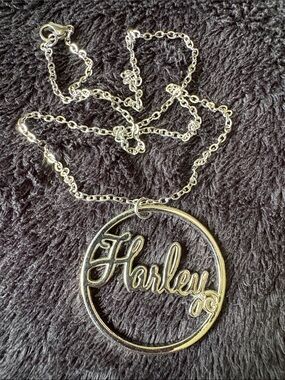 Authentic Harley Davidson Pendent. 
Feminine Script “Harley” Circular Pendant.